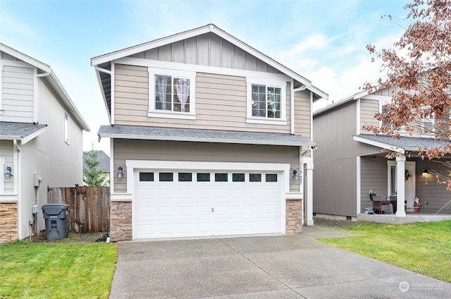 view of front of house featuring a front yard and a garage