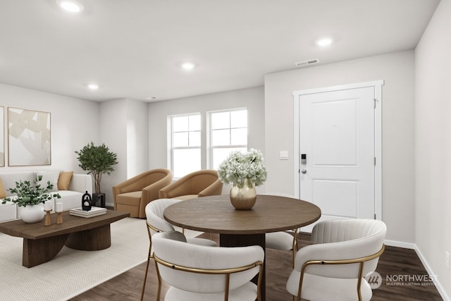 dining space featuring dark hardwood / wood-style floors