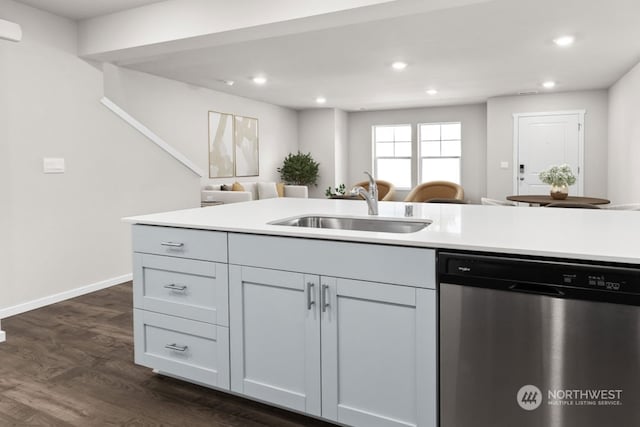 kitchen featuring gray cabinetry, dishwasher, dark hardwood / wood-style floors, and sink