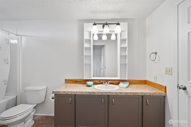 full bathroom featuring vanity, tile patterned floors, toilet, a textured ceiling, and shower / tub combo with curtain