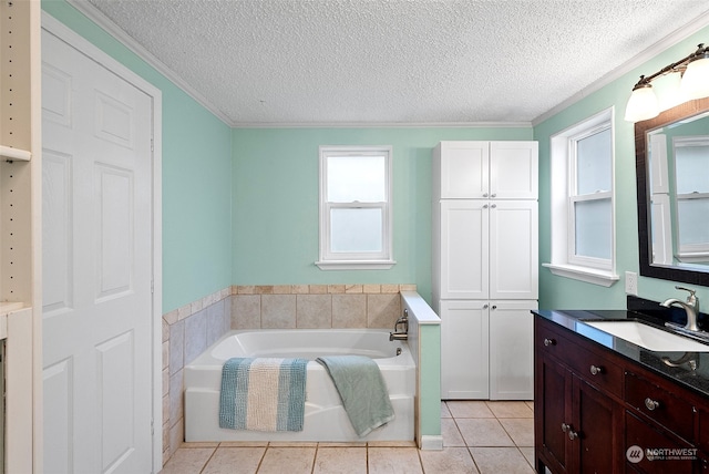 bathroom with tile patterned flooring, a textured ceiling, crown molding, and a tub