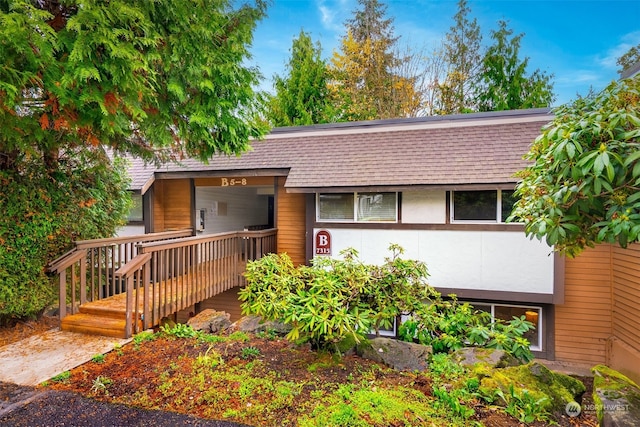 view of front of house with a wooden deck