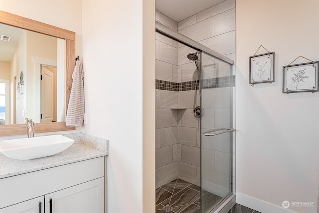 bathroom with vanity and walk in shower