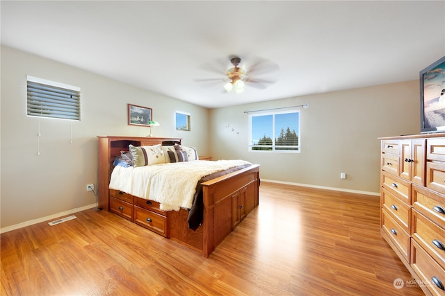 bedroom featuring ceiling fan and light hardwood / wood-style floors