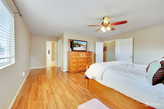 bedroom featuring ceiling fan and light hardwood / wood-style floors