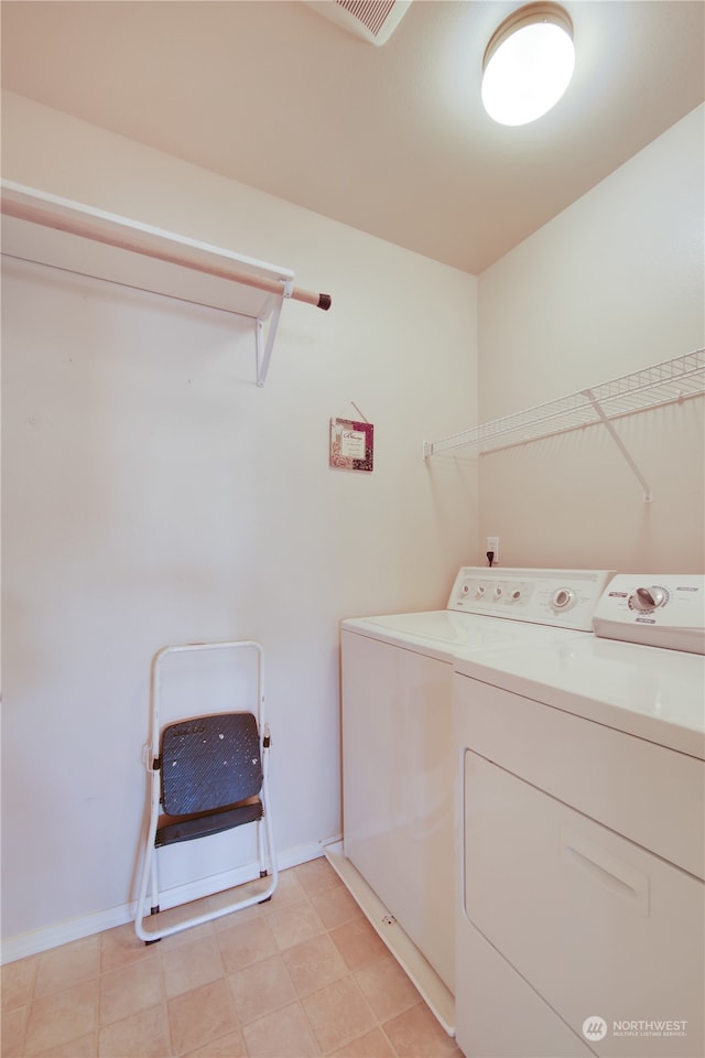 clothes washing area featuring washing machine and dryer