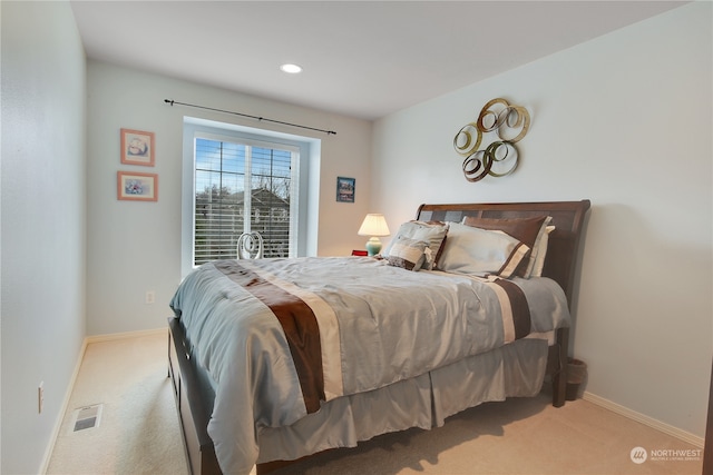 bedroom with light carpet