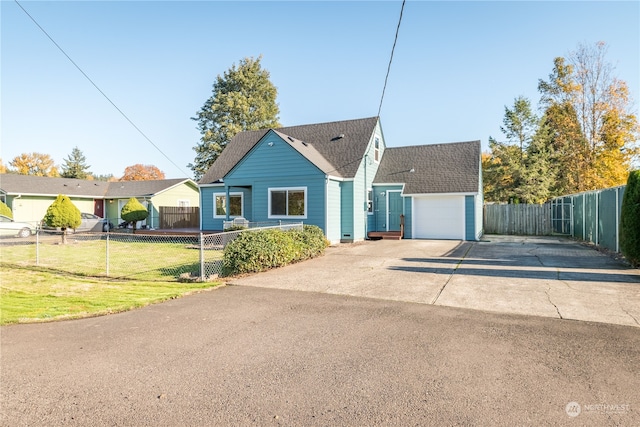 view of front of home with a garage and a front yard