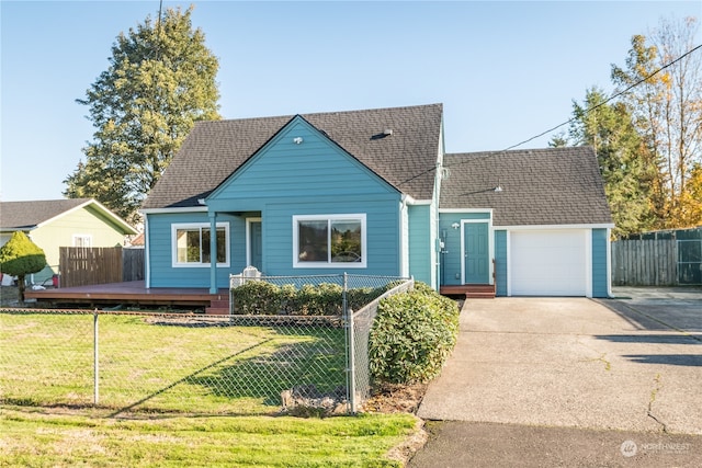 view of front of house with a front yard and a garage