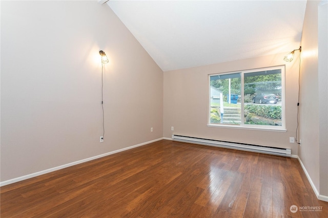 empty room with wood-type flooring, baseboard heating, and vaulted ceiling