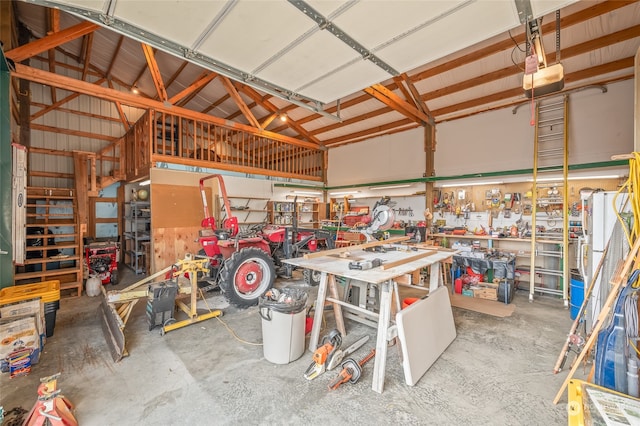 garage featuring a workshop area and a garage door opener