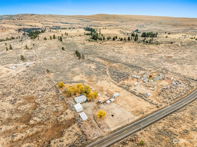 bird's eye view featuring a mountain view and a rural view