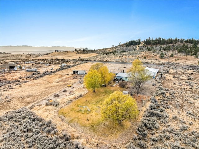 aerial view with a mountain view and a rural view