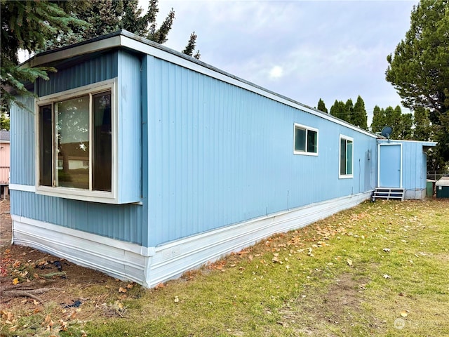 view of home's exterior with a yard