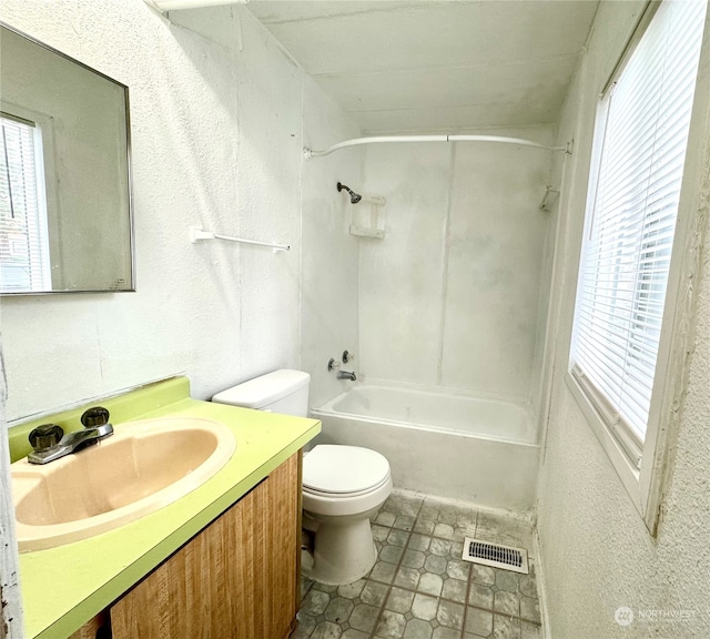 full bathroom with shower / bathing tub combination, vanity, and toilet