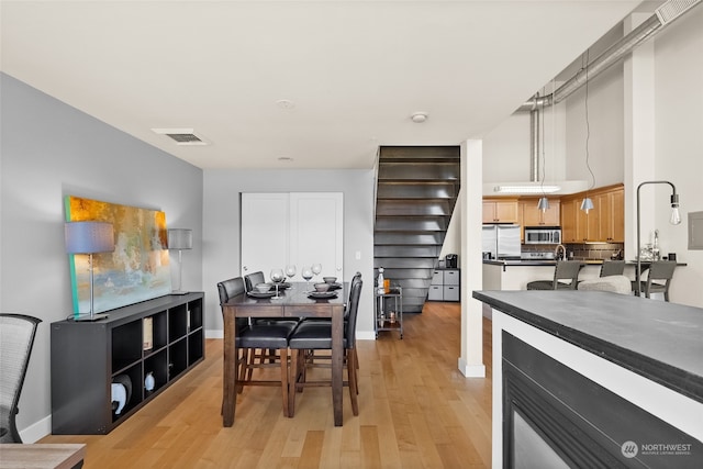 kitchen with appliances with stainless steel finishes and light wood-type flooring