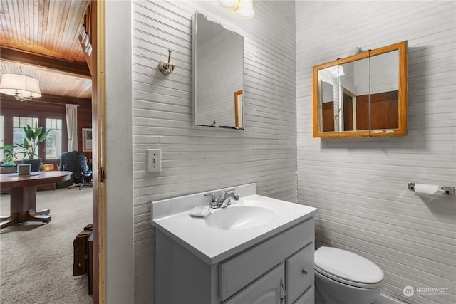 27525 W Lake Riley Rd, Arlington, WA 98223 - bathroom featuring wooden ceiling, toilet, and vanity