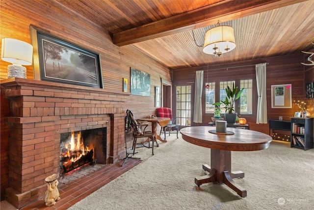 27525 W Lake Riley Rd, Arlington, WA 98223 - living area with wood ceiling, a fireplace, wood walls, and carpet flooring