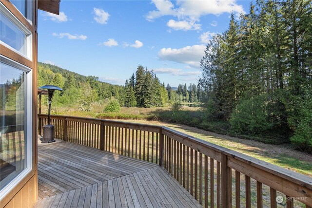 27525 W Lake Riley Rd, Arlington, WA 98223 - wooden deck featuring a view of trees