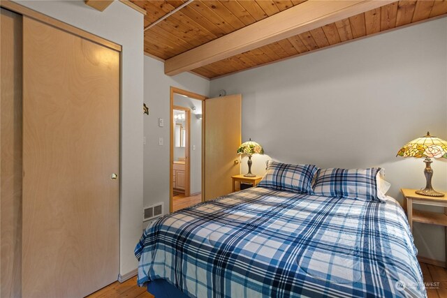 27525 W Lake Riley Rd, Arlington, WA 98223 - bedroom with wood ceiling with exposed beams, light wood finished floors, and a closet