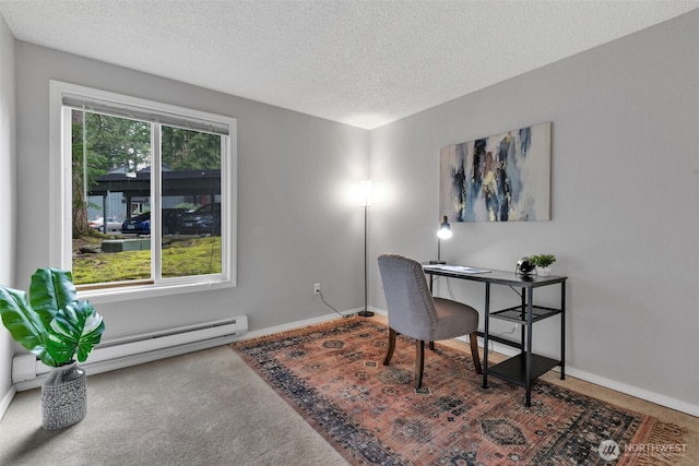 carpeted office with a textured ceiling, a baseboard radiator, baseboards, and a healthy amount of sunlight