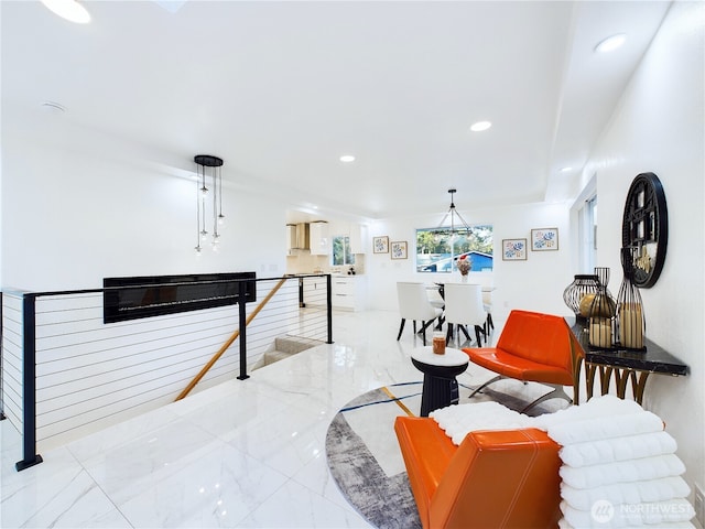 living room featuring marble finish floor and recessed lighting