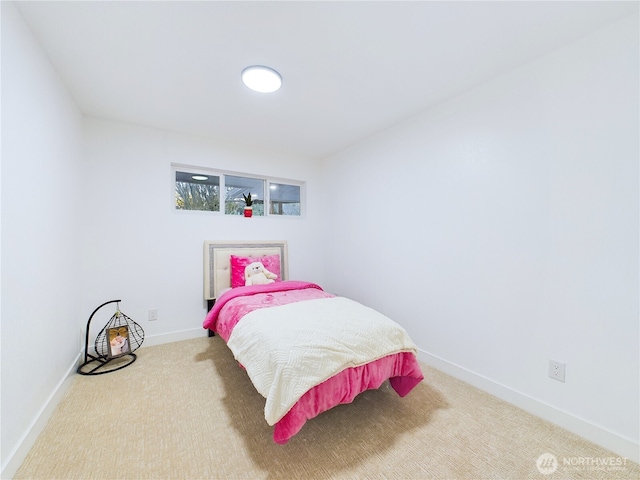 carpeted bedroom with baseboards