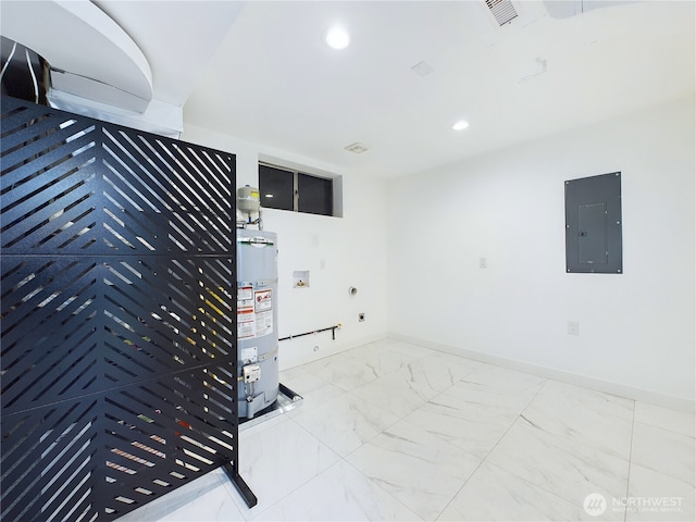 interior space featuring marble finish floor, recessed lighting, visible vents, water heater, and electric panel