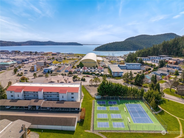 bird's eye view with a water and mountain view