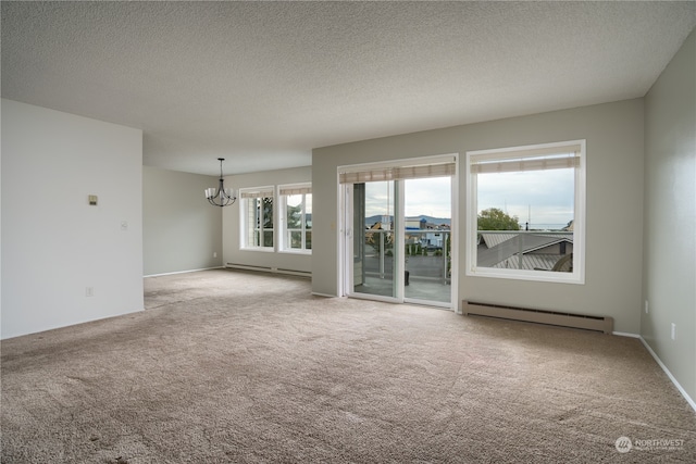 carpeted spare room featuring a chandelier, a baseboard radiator, and a textured ceiling