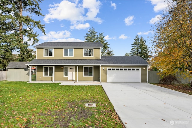 view of property with covered porch, a garage, and a front yard