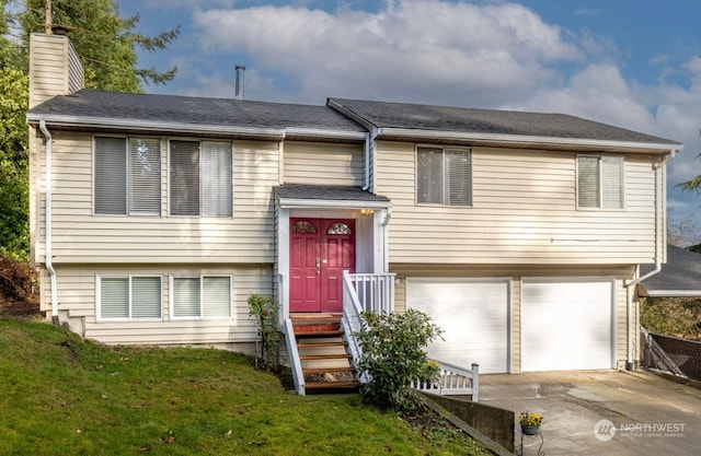 split foyer home featuring a garage