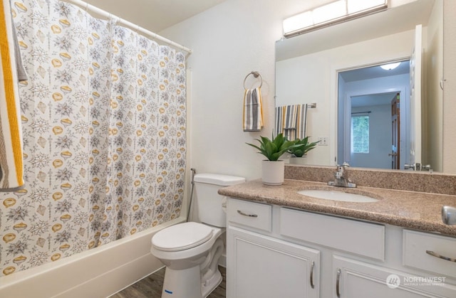 full bathroom with wood-type flooring, vanity, toilet, and shower / tub combo with curtain