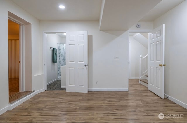 interior space featuring ensuite bathroom and hardwood / wood-style flooring