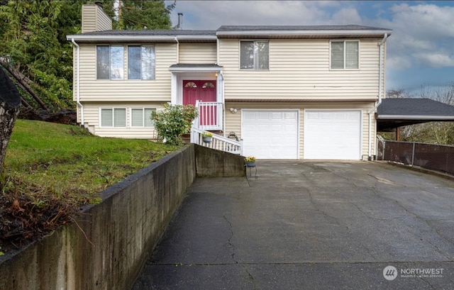 bi-level home featuring a garage