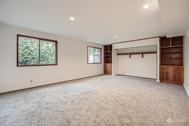 unfurnished bedroom featuring carpet flooring and a closet