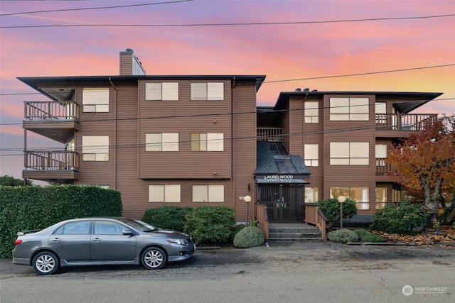 view of outdoor building at dusk