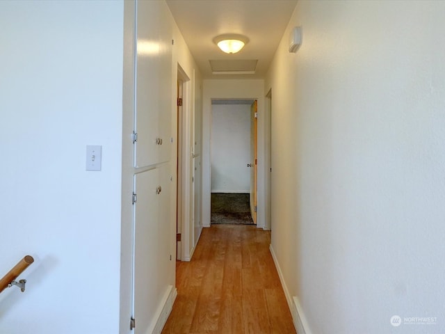 hall with light wood-type flooring