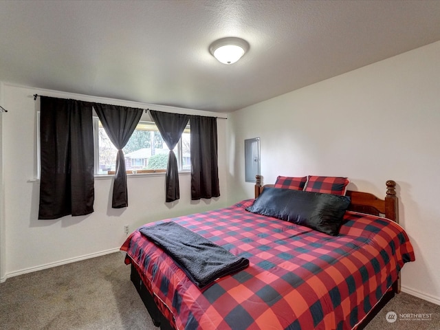 carpeted bedroom featuring a textured ceiling