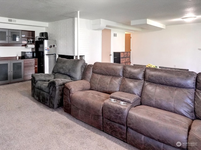 carpeted living room with a textured ceiling