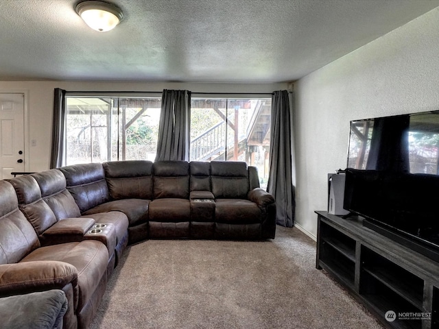 carpeted living room featuring a textured ceiling