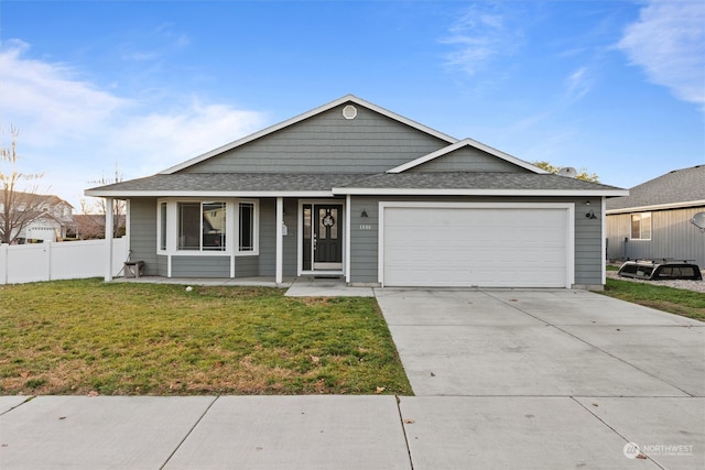 ranch-style home with a front yard and a garage