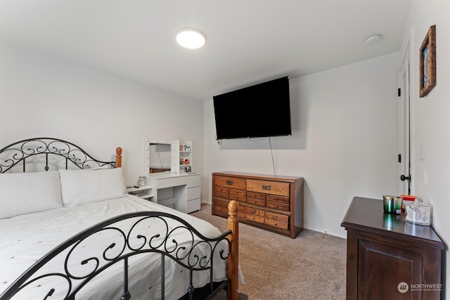 bedroom featuring light carpet