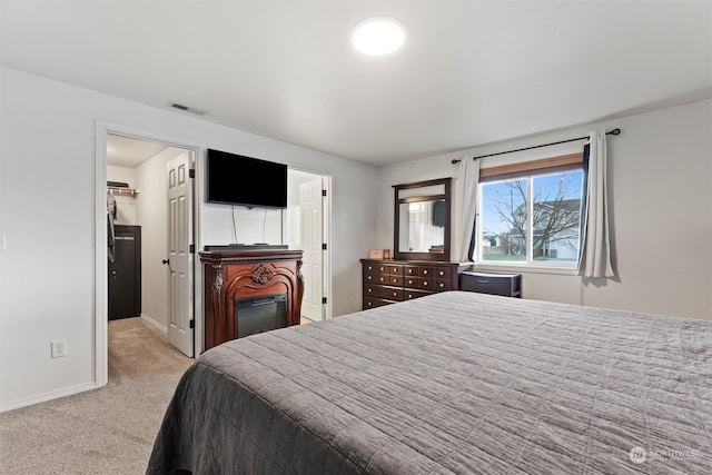 bedroom with light carpet