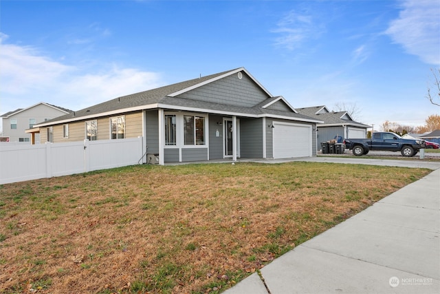 single story home featuring a front lawn and a garage