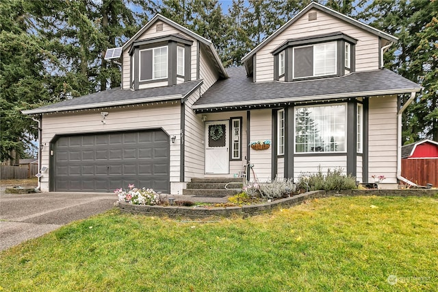 view of front facade featuring a garage and a front lawn