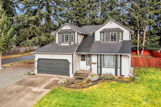 front of property with a front yard and a garage