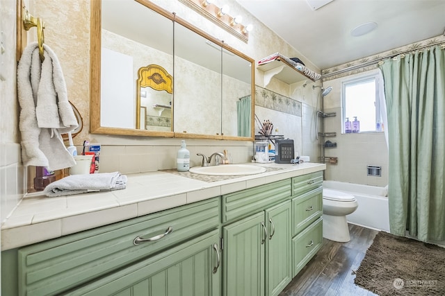 full bathroom featuring shower / bath combination with curtain, backsplash, vanity, hardwood / wood-style floors, and toilet