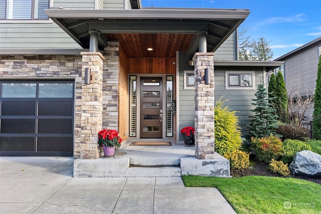 doorway to property featuring a garage