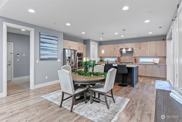 dining area with light hardwood / wood-style flooring